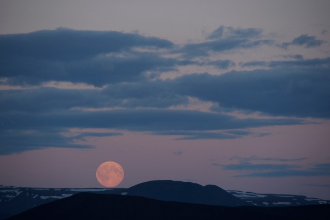A midsummer full moon rising over Hverfjall Crater at Myvatn
