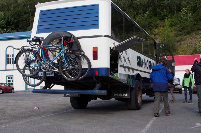 The bikes on the back of the bus