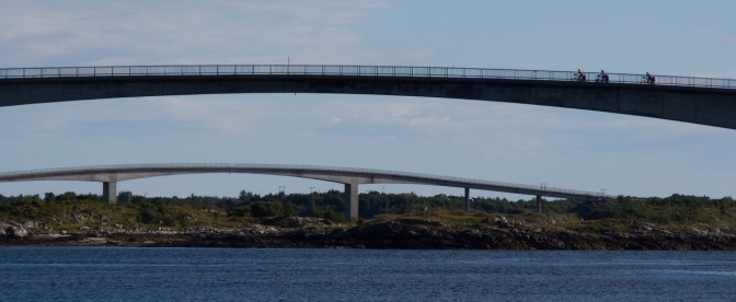 Alba, Gérard and Jan cycling across one of five bridges connecting the Herøy group of islands.