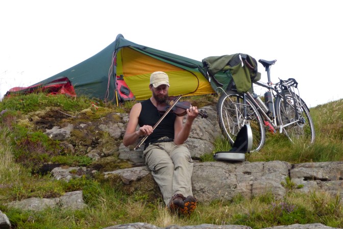 Jim playing his fiddle at our camp near Å.