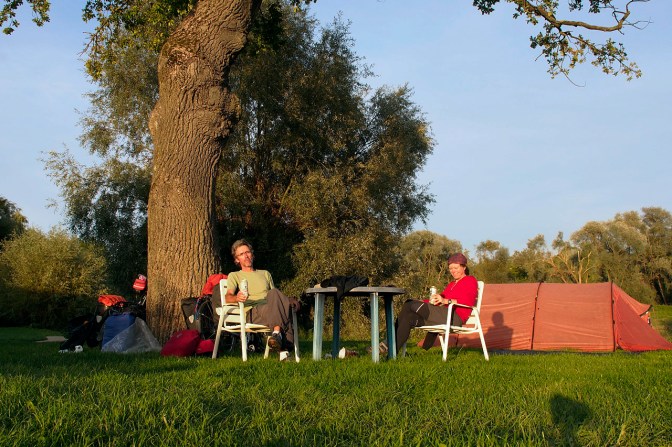Enjoying the sun at a canoe club campsite along the Danube River.