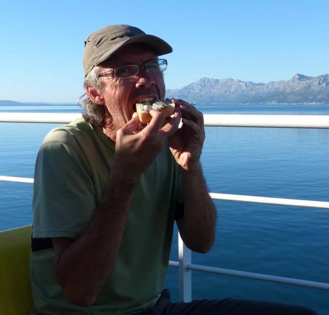 Putting fuel into the machine on the ferry to Trpanj.