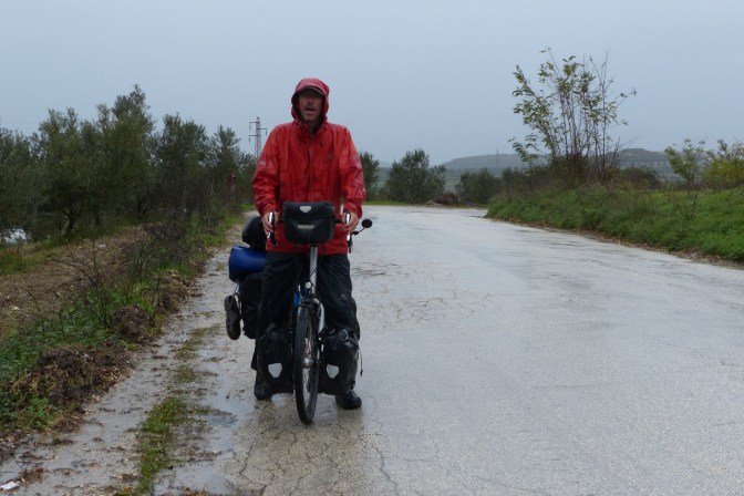 Paul taking a moment in the pissing rain on the way to Vlorë.