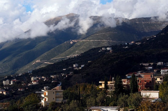 Dhërmi with the road from Logora Pass in the background.