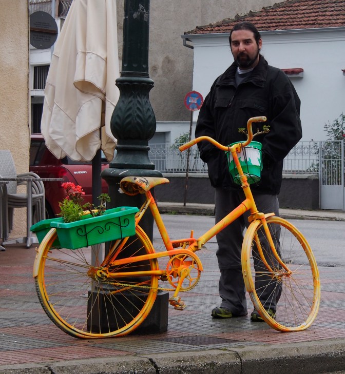 Yannis with one of the bicycle planters in Elassona.