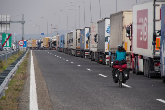 Riding past several kilometres of transport trucks waiting to cross the border in Turkey.