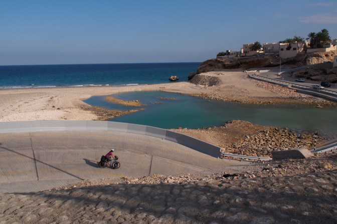 Sebastian descending a steep road into Wadi Shab.