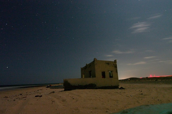 Our little mosque on the beach by night.