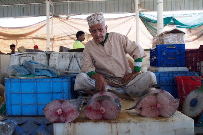 Selling his wares at the Muttrah fish market.