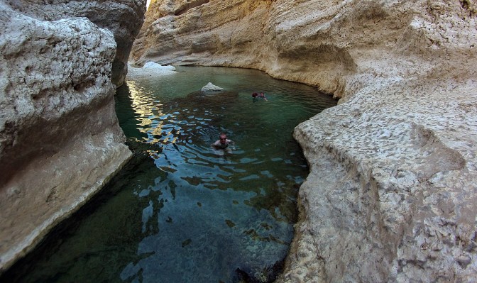 Jan and Sebastian swimming further into Wadi Shab.