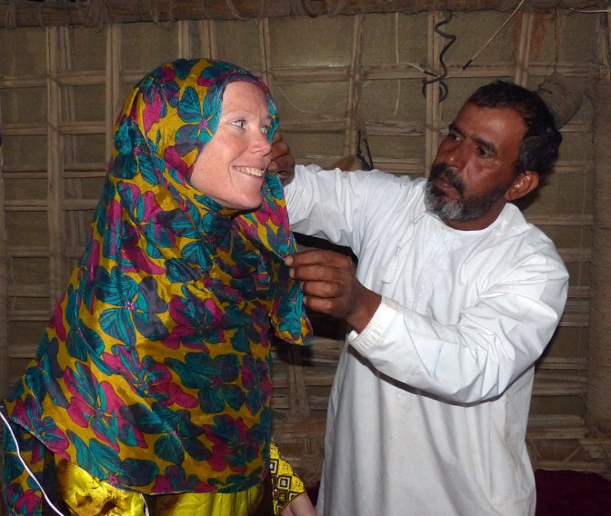 Jan getting dressed up at Wahiba Sands desert camp.