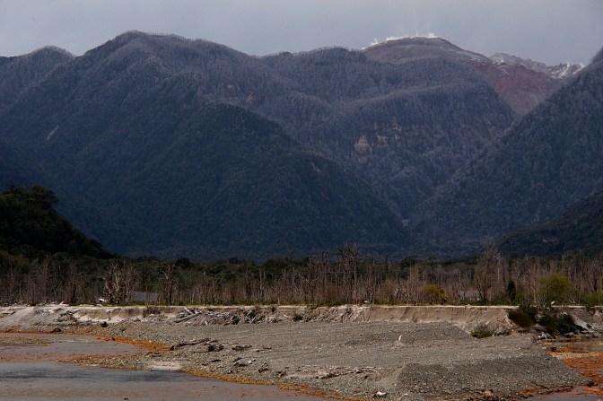 Chaitén Volcano smoking ominously over the town of Chaitén. An eruption in 2008 destroyed the town.