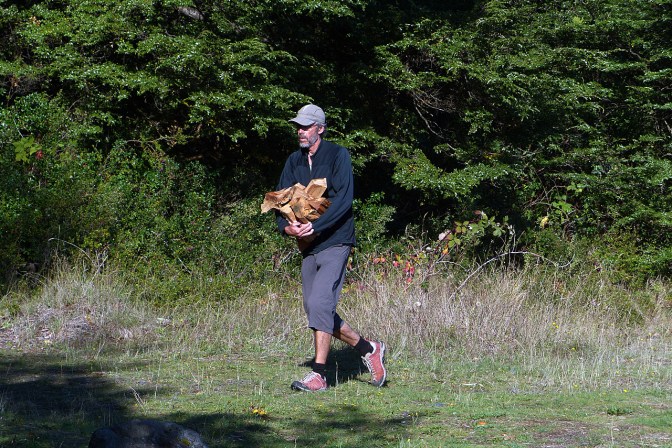 Paul hauling fire wood to camp at Lago Llanquihue.