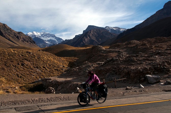 Jan riding past Aconcagua as we climb over 3,000 metres above sea level to the border with Chile.