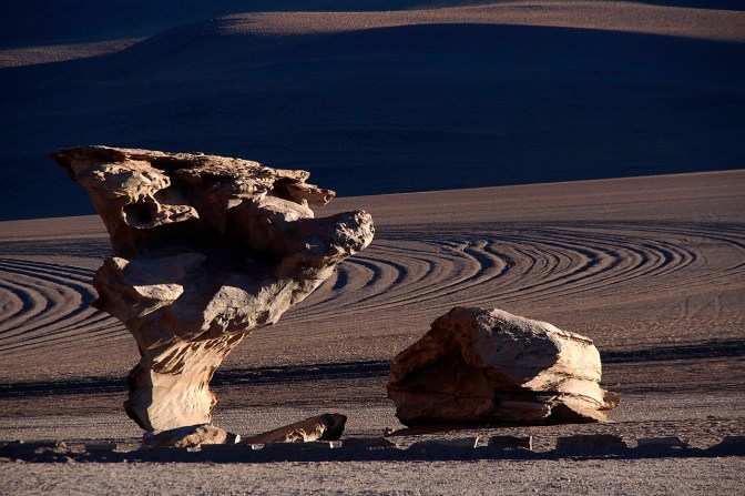 Arbol de Piedra at sunset. Jeep tracks in the background.