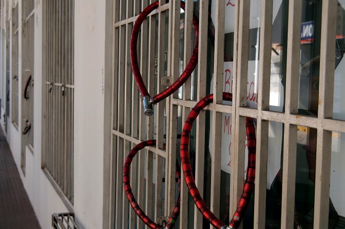 Bike locks used to secure shop doors.