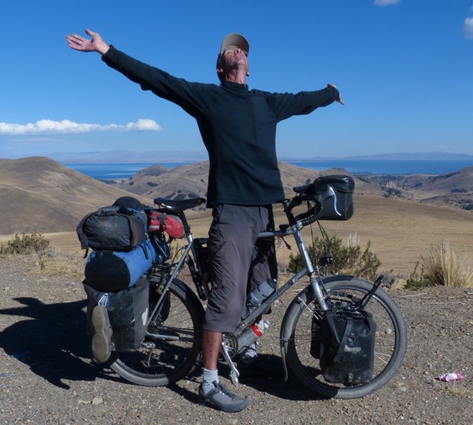 After two and a half hours and 27 km of climbing Paul celebrates arriving in the pass above Copacabana at 4,260 metres.