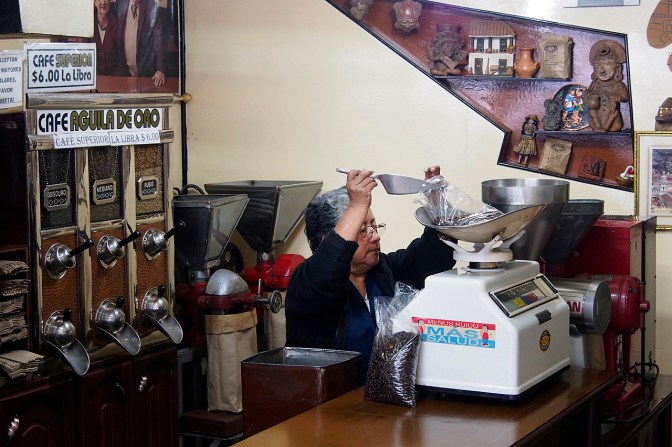 Coffee roaster weighing out the precious beans.
