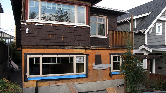 Old becoming new again. An old house down the street was raised and given a new foundation.