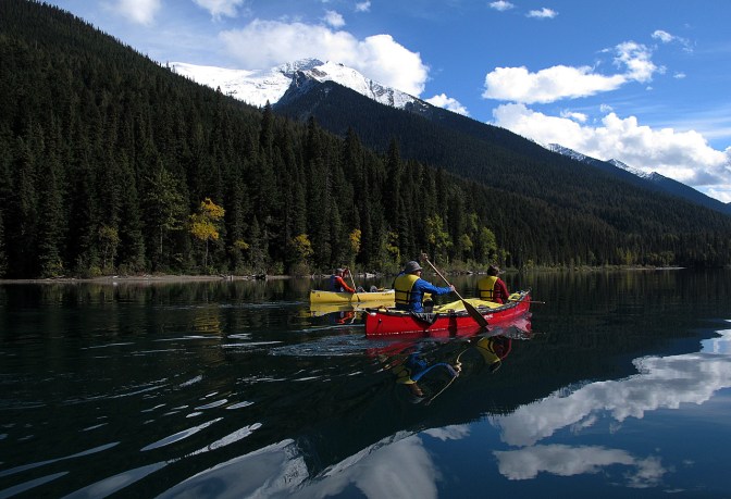 Sunshine and snowy peaks on Isaac Lake.