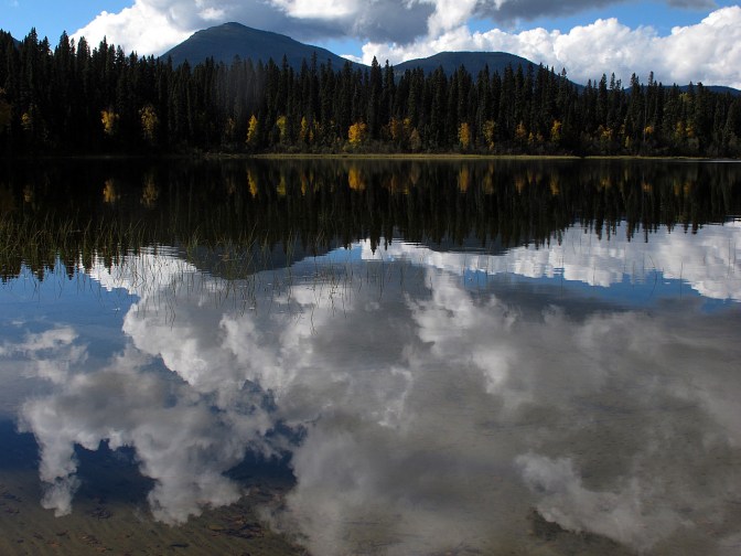 The Quesnel Highlands reflected in the Spectacle Lakes.