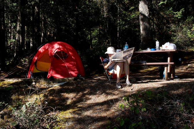 Relaxing with a day-old newspaper.